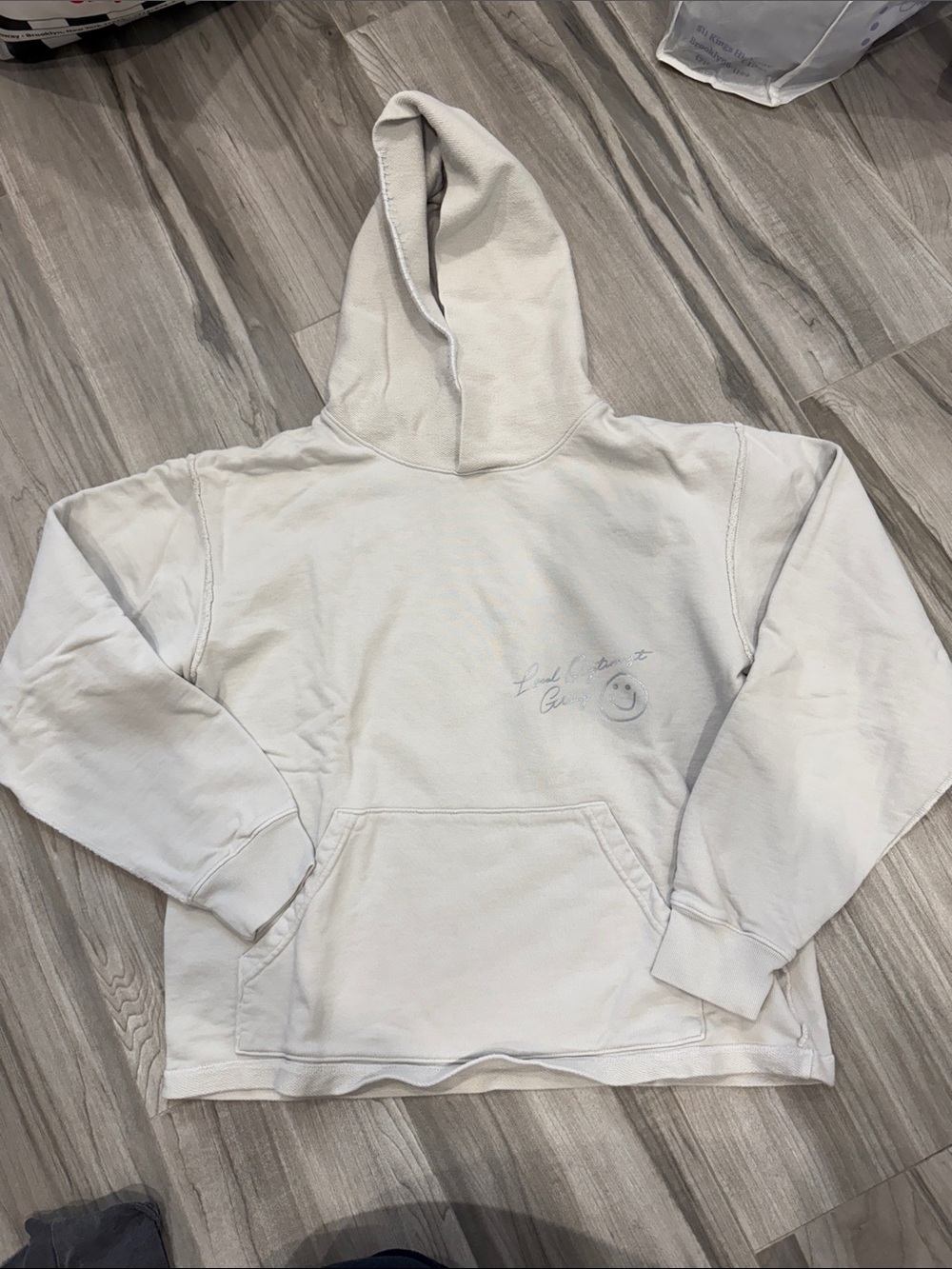 Madhappy Off-White Hoodie with Subtle Smile Detail